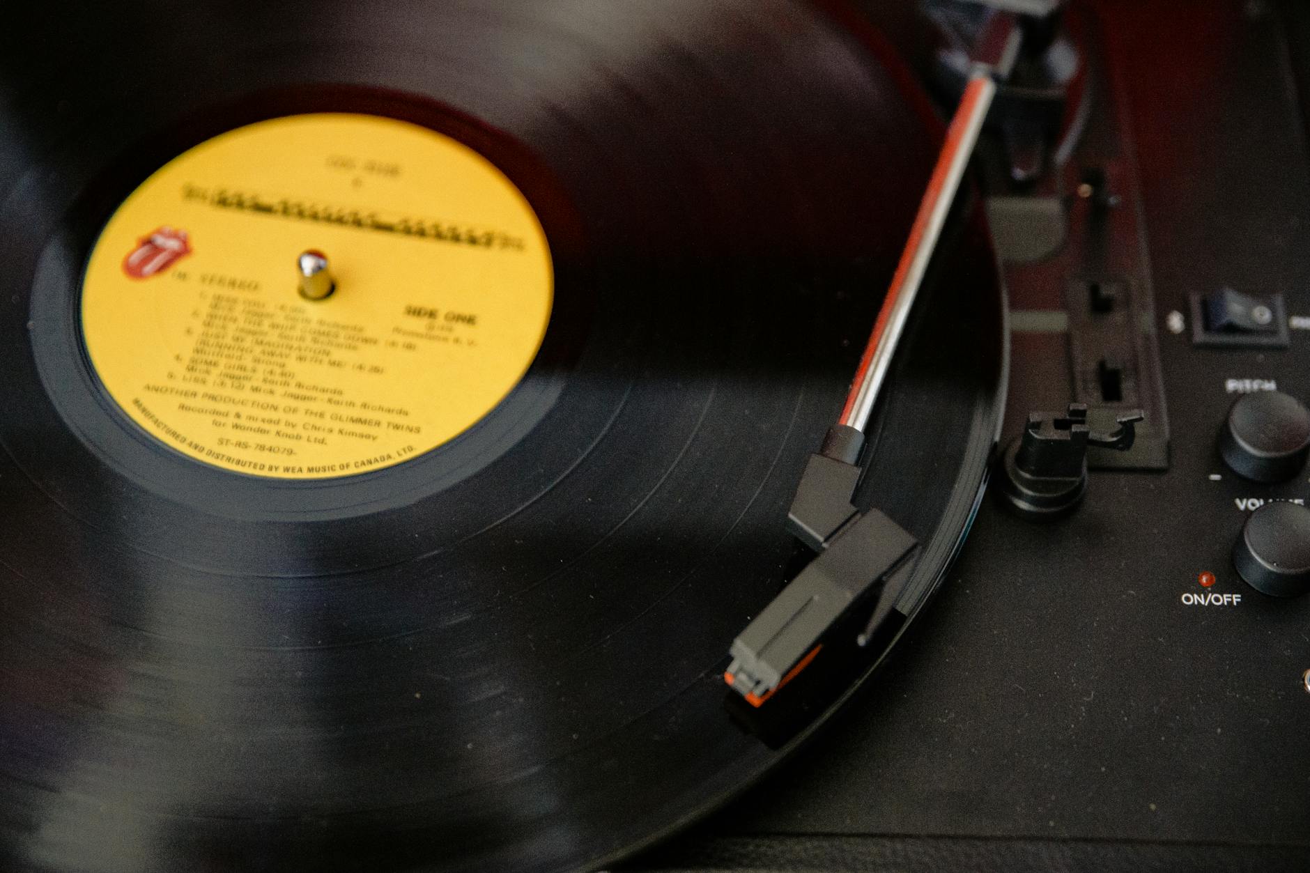 black vinyl record on vinyl record player